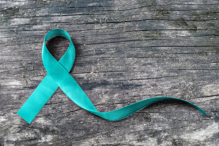 a green ribbon symbolizing ptsd awareness month